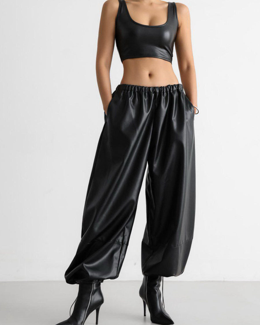 PU leather women’s pants styled with crop top and heels