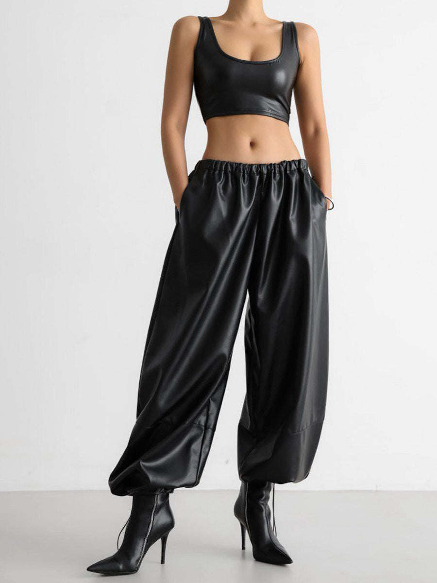 PU leather women’s pants styled with crop top and heels