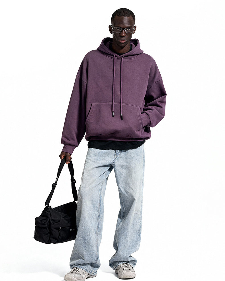 Purple oversized hoodie front view on model, roomy street fit