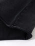 Close-up of T-shirt hem with slightly curled loose edge for casual finish.