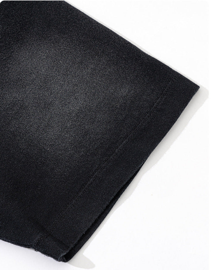Detailed view of T-shirt sleeve showing rotator cuff seam and clean stitching.