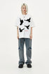 Front view of oversized white crewneck T-shirt with four contrasting raised flying dove motifs