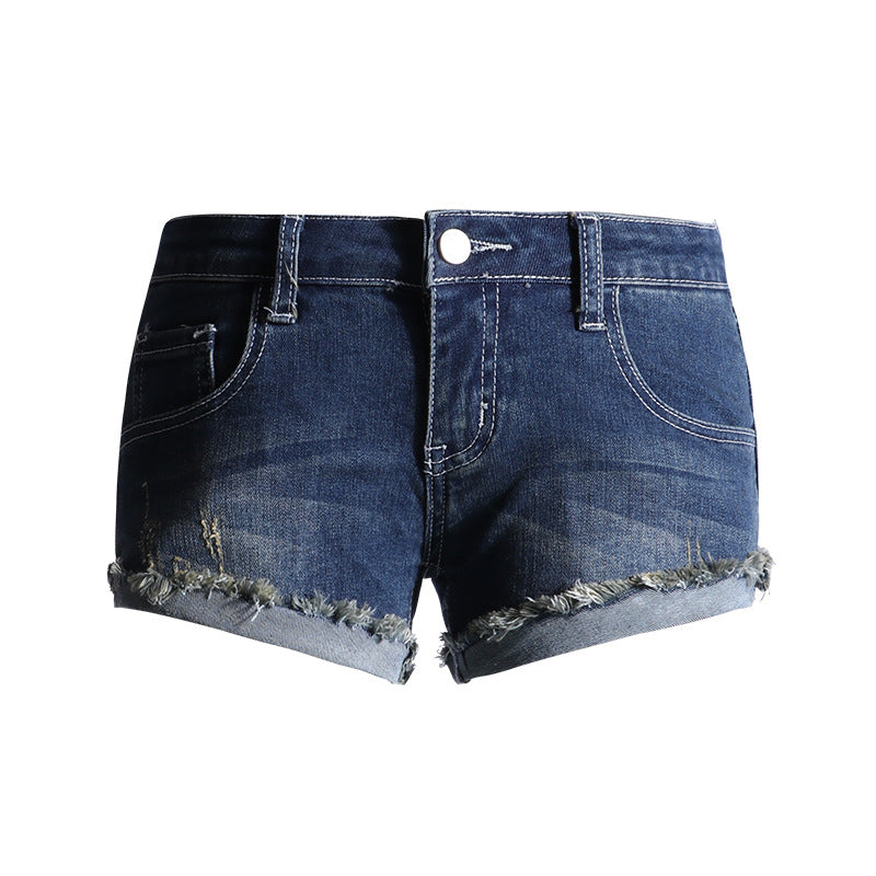 Close-up of dark blue slim fit denim shorts with raw hem and front pockets.