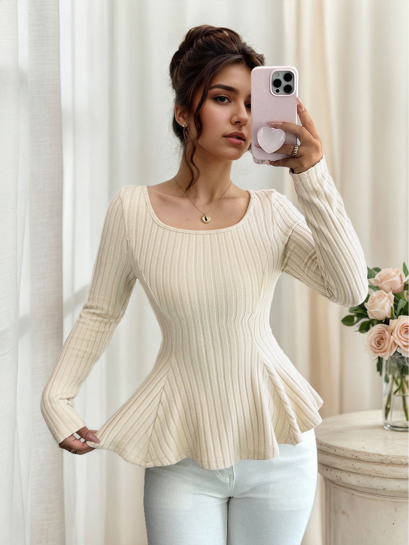 side angle, cream ribbed U neck long sleeve top with fluted peplum and fitted waist