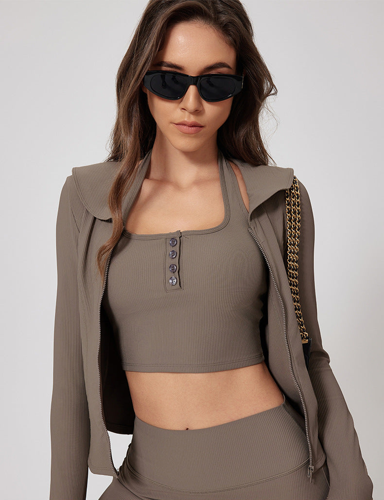 Close-up of taupe ribbed athletic jacket with cropped sports bra