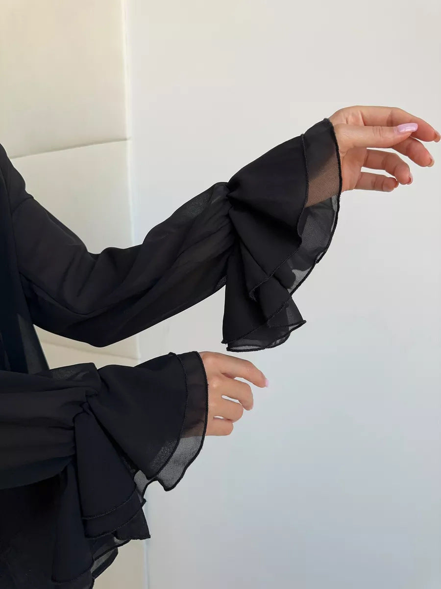 Sheer black blouse sleeves with double-layer ruffle cuffs