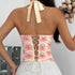 Back view of ivory floral corset with lace trim and strapless cut.