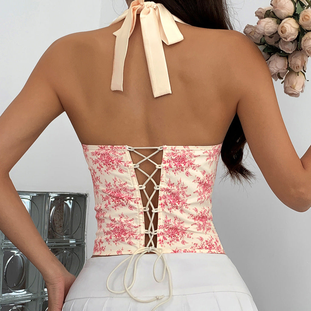 Back view of ivory floral corset with lace trim and strapless cut.