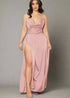 Woman wearing a pink light evening gown with a high slit.