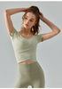 sisal yoga top with scoop neckline and cross-pleat front in cropped cut.