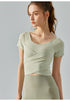 Sisal short sleeve yoga top with slim fit and removable chest pads.