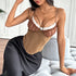  Woman sitting in brown corset top with white lace trim and boned bodice.