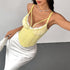 Side angle of yellow corset top showing ruffled cups and boning details.