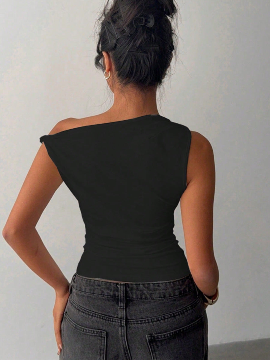 Back view of off shoulder top in black with asymmetrical neckline