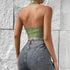 Back view of sage green halter PU corset top showing halter strap and snug fit.