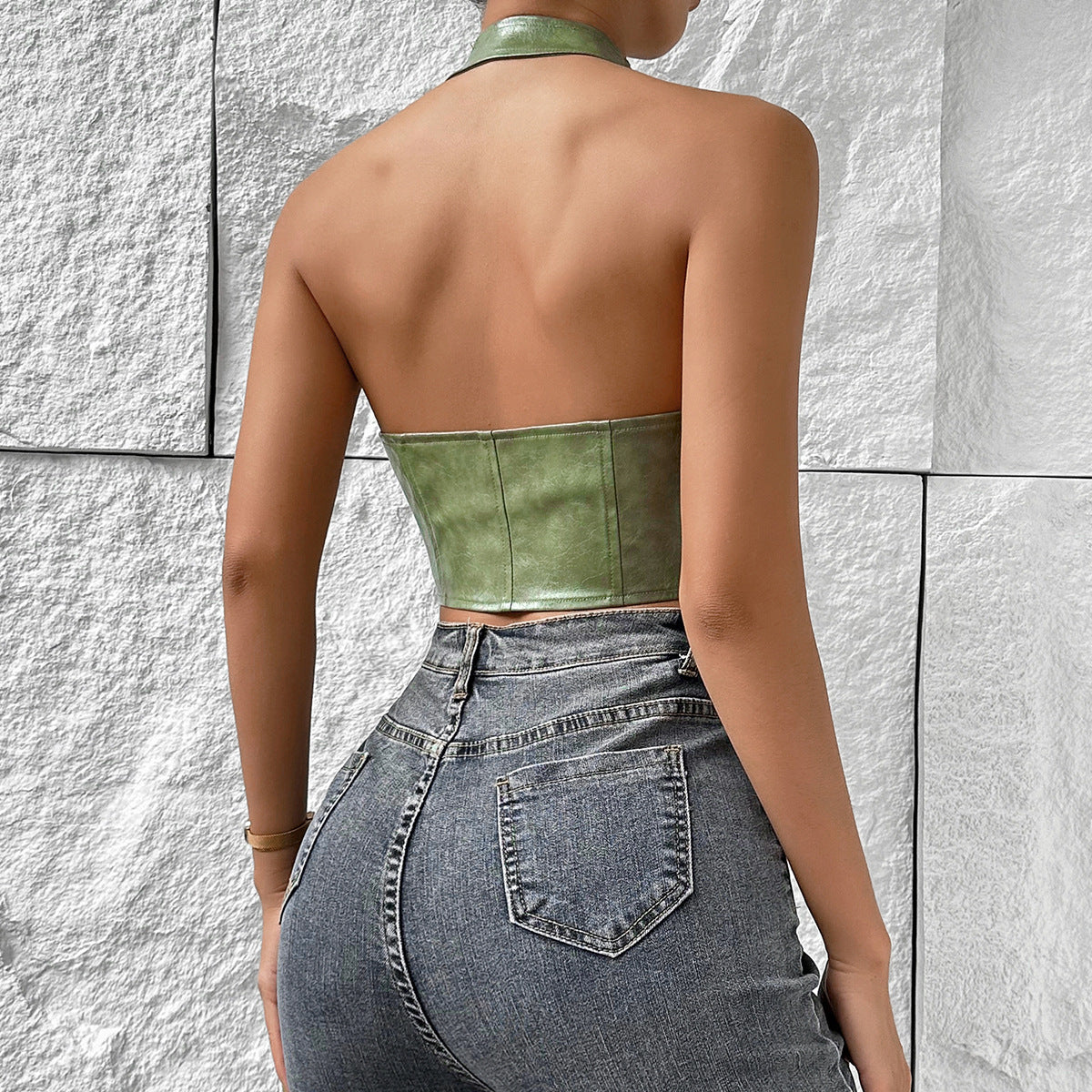 Back view of sage green halter PU corset top showing halter strap and snug fit.