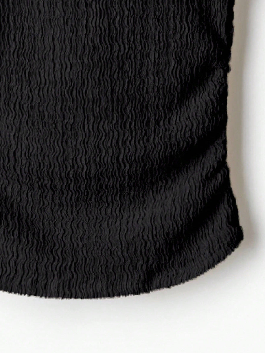 hem detail of shirt long sleeve tshirts, black crinkle knit texture close-up, clean finish