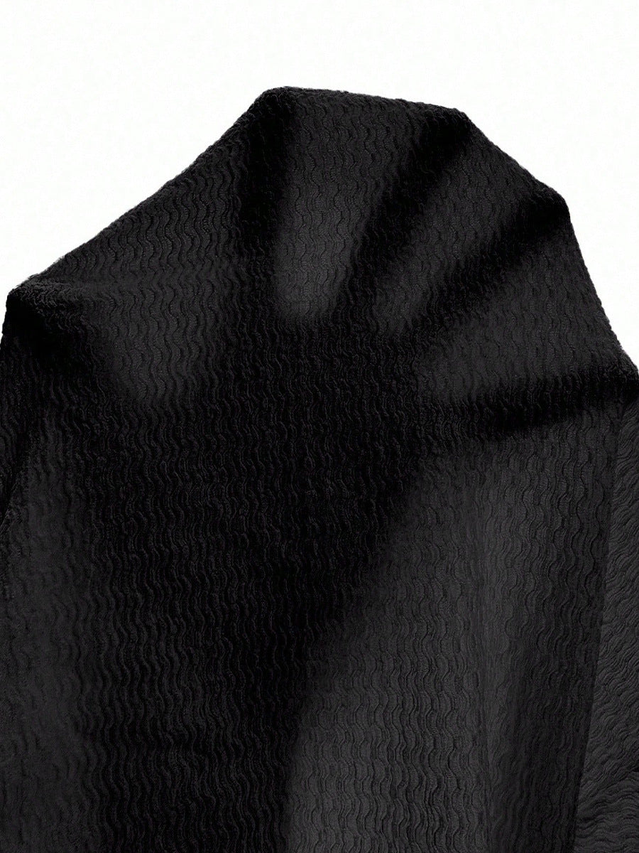 sleeve detail of shirt long sleeve tshirts, black textured knit, soft stretch close-up