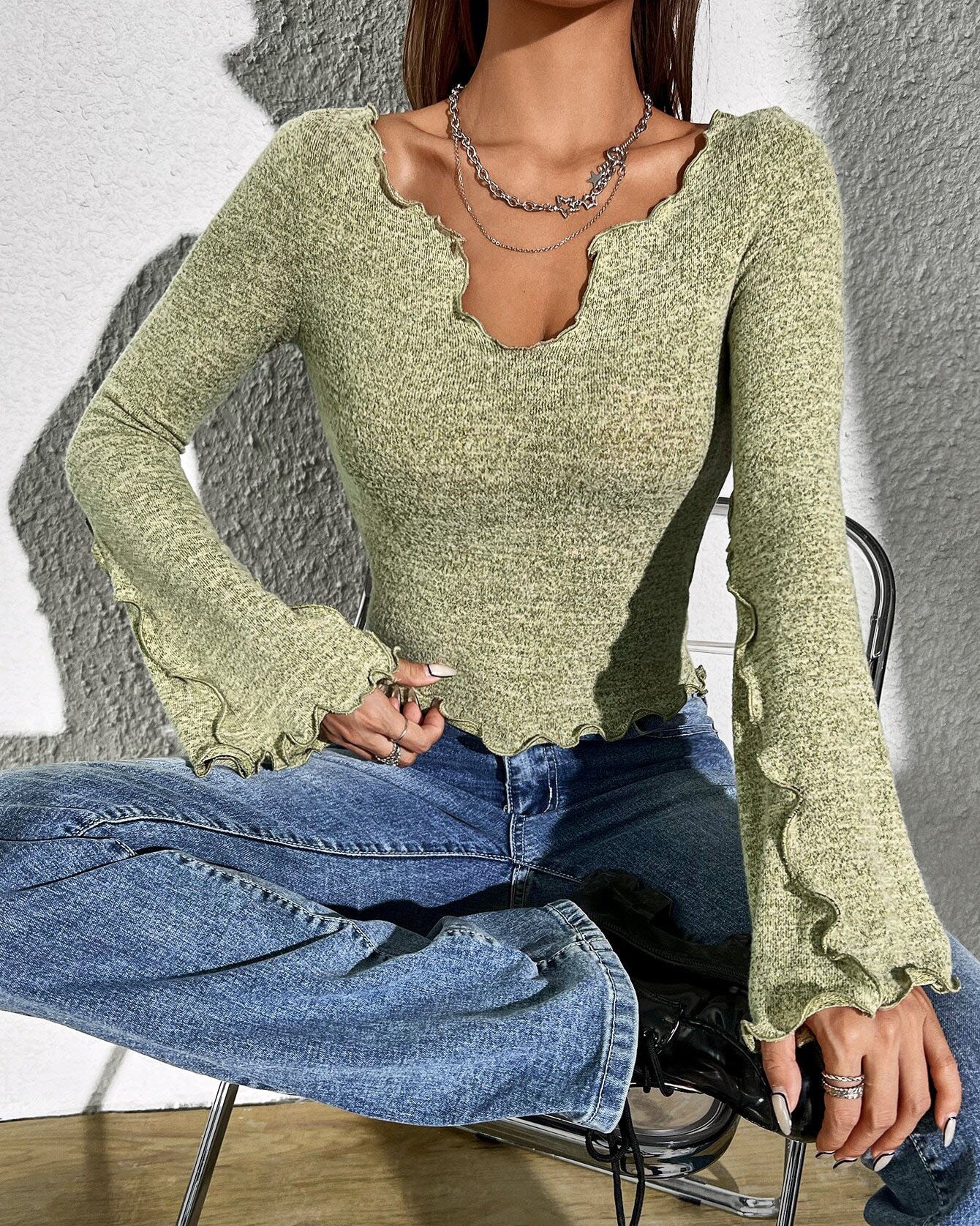 grass green shirt-style long sleeve T-shirt, slim fit with bell sleeves, front seated view