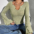 close crop showing irregular collar and bell cuff on green slim fit shirt-style tee