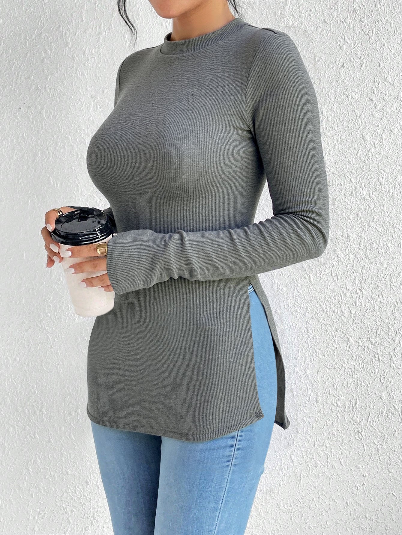 shirt-style long sleeve T-shirt, slim fit ribbed knit with side slit, crew neck, front view holding cup