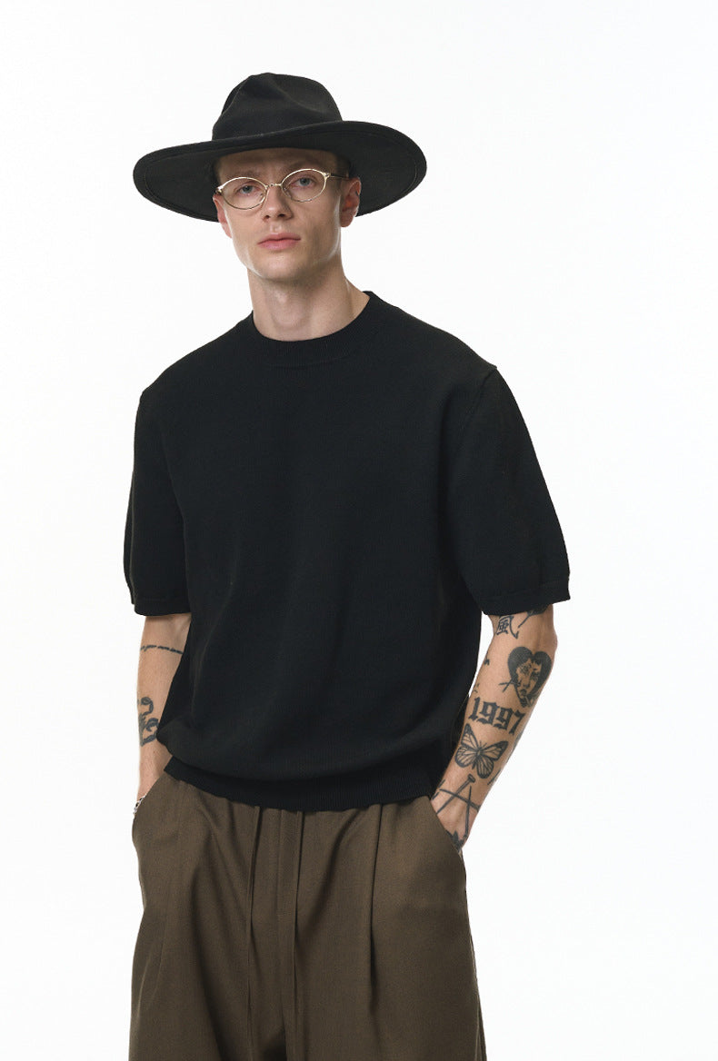 Black short sleeve knit top front view with wide-brim hat