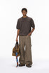 Model wearing brown short sleeve knit top with crew neck