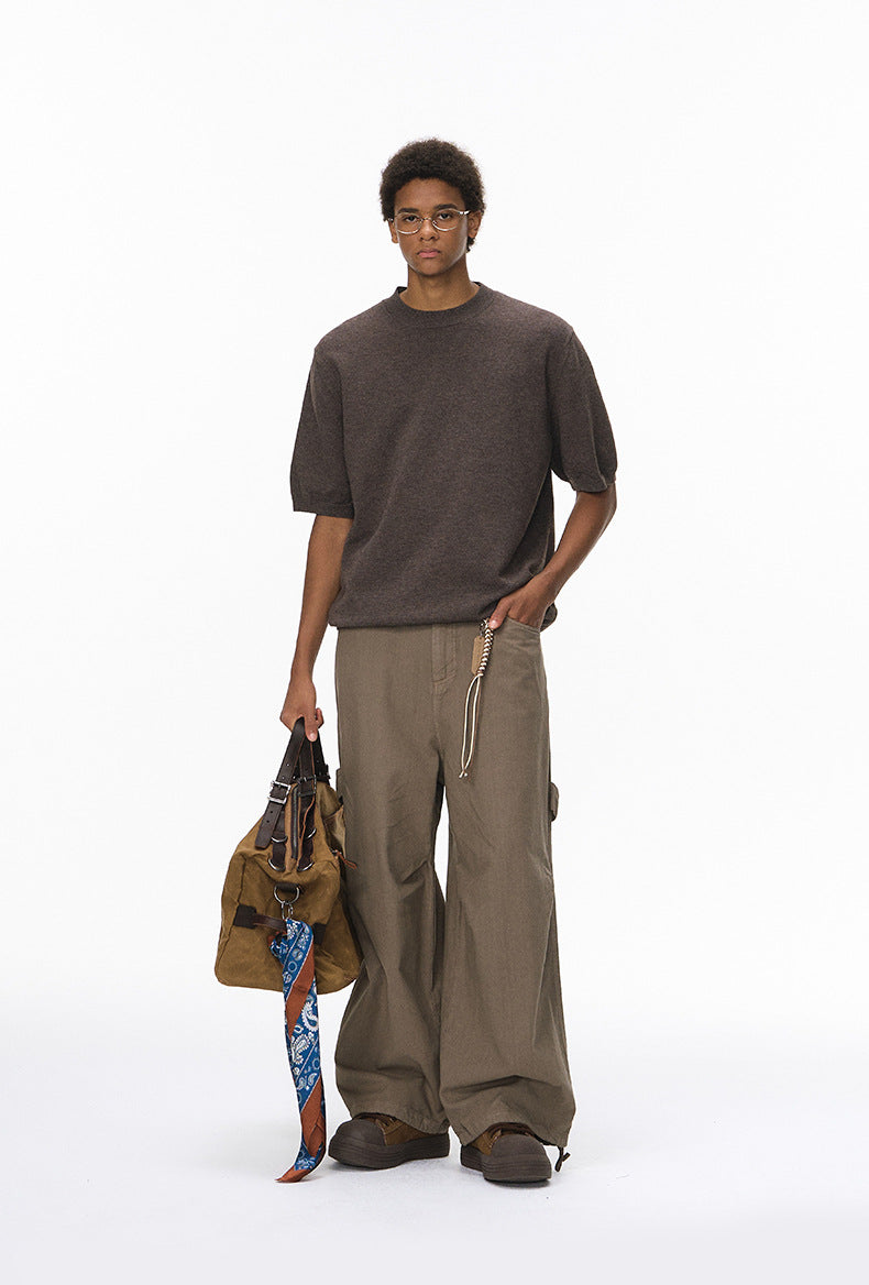 Model wearing brown short sleeve knit top with crew neck