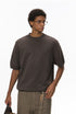 Close-up of crew neck detail on brown short sleeve knit top