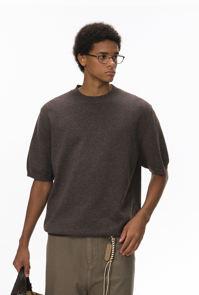 Close-up of crew neck detail on brown short sleeve knit top
