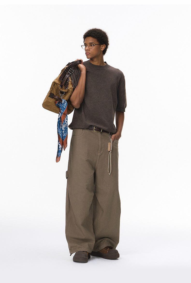 Side angle of brown short sleeve knit top in regular fit
