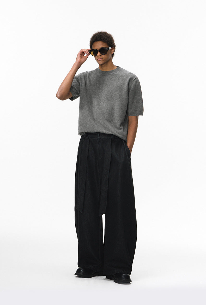 Gray short sleeve knit top styled with black wide-leg pants