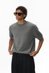 Gray short sleeve knit top side view on male model
