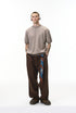 Khaki short sleeve knit top styled with brown pants
