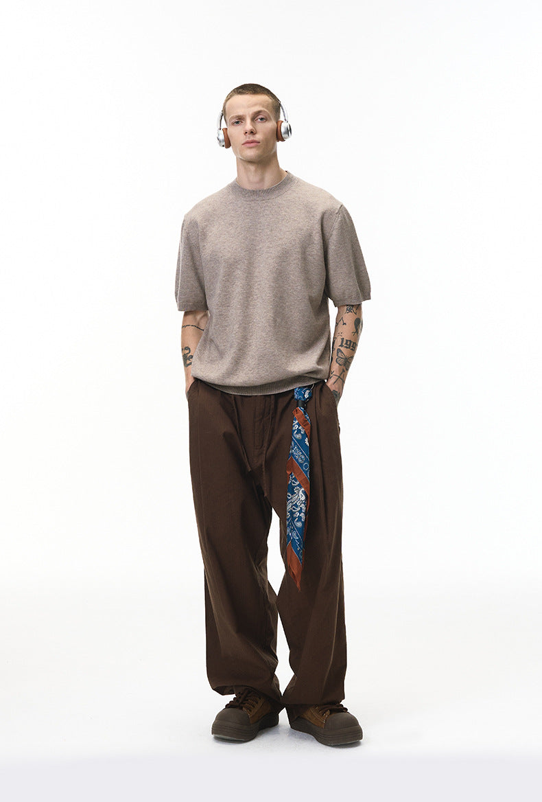 Khaki short sleeve knit top styled with brown pants