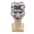 Silver owl mask on a mannequin head against a white background