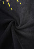 Twisted close-up of soft black cotton fabric