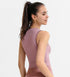 Back of pink ribbed tank worn with matching leggings.