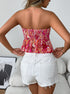 Back view of cranberry smocked boho strapless tube top with flare hem in paisley print
