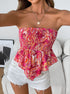 Woman selfie wearing cranberry smocked boho strapless tube top with flare hem in paisley print