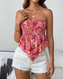 Woman wearing a cranberry smocked boho strapless tube top with flare hem in paisley print