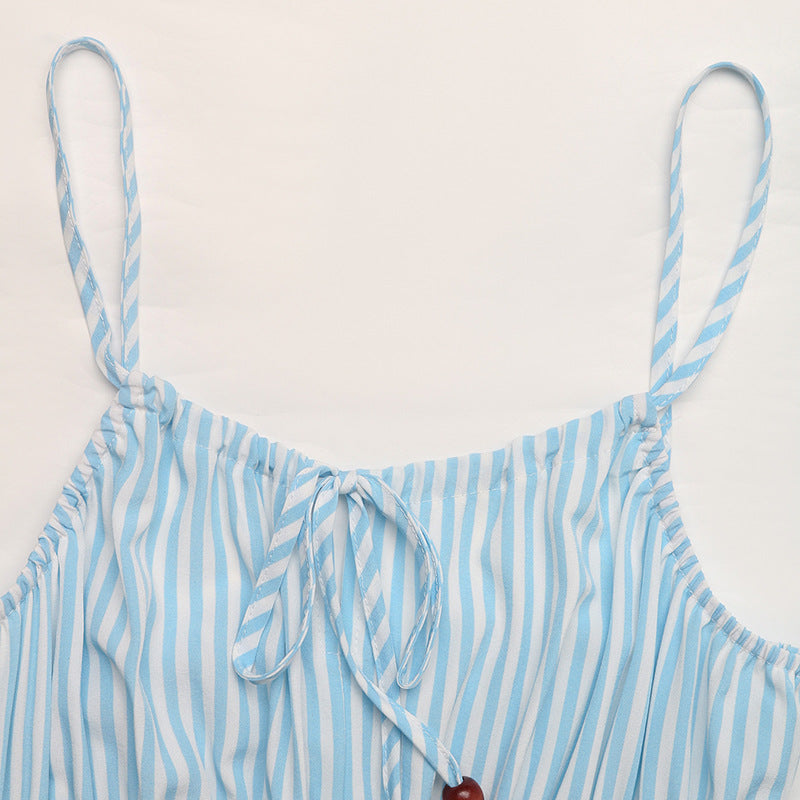 Flat lay of cami dress top showing tie neckline and blue-white stripes.