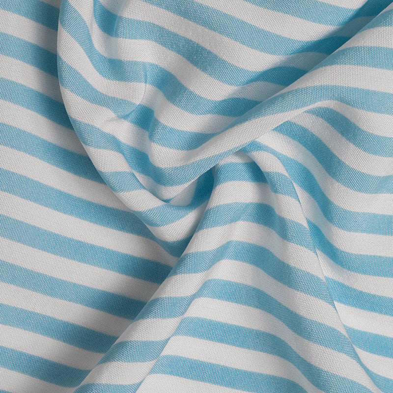 Fabric close-up showing soft blue and white vertical stripes in lightweight weave.