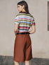 Back view of striped crop polo shirt and brown shorts.
