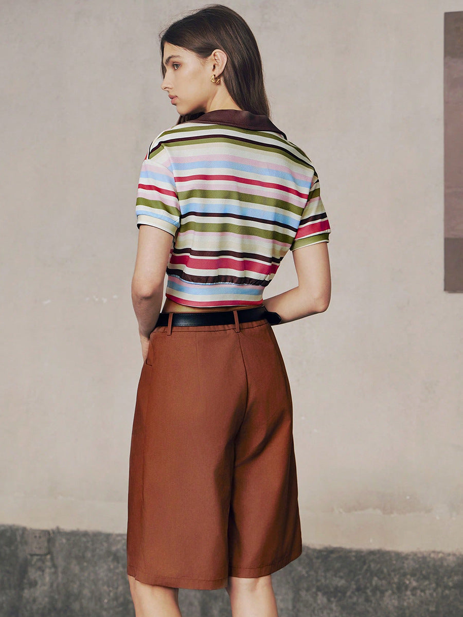 Back view of striped crop polo shirt and brown shorts.