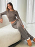 striped lounge co ord set with long sleeve crop top and wide leg pants relaxed pose