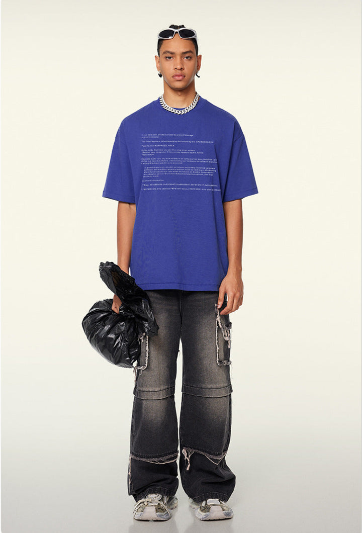 Model wears academy blue crash report tee with distressed black cargo pants.
