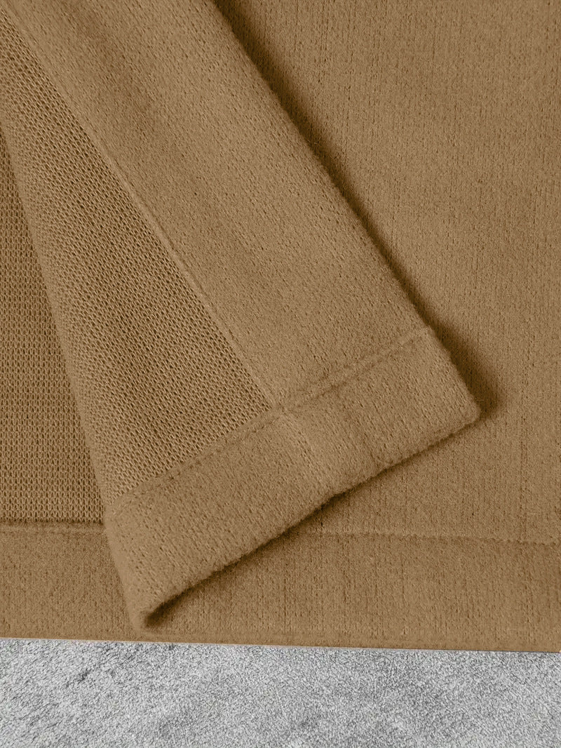 close-up of tan wool jacket sleeve hem detail
