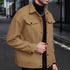 tan men’s wool jacket styled with black turtleneck on street