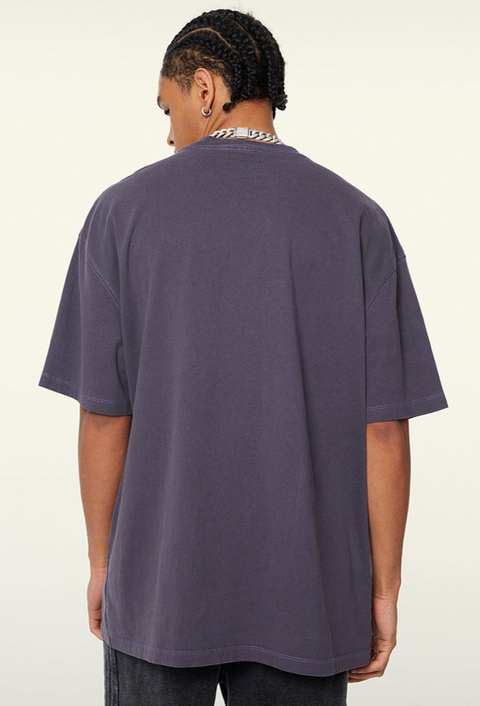 Back view of purple "Terrible Beauty" tee.